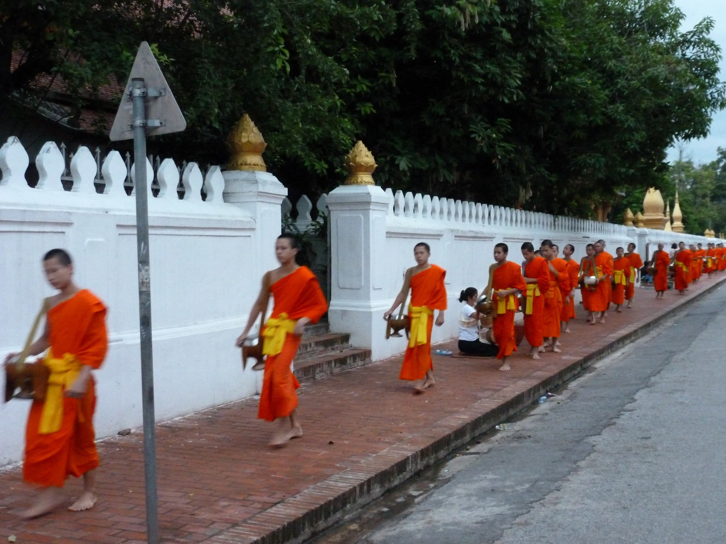 Young monks alms giving