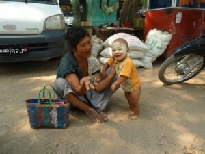 A baby wearing Thanaka Paste - InsideBurma Tours