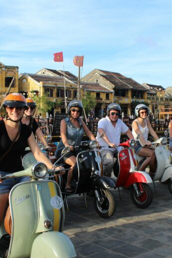 Our Vespa tour on the banks of the river, ready to head out on our Streets & Eats adventure