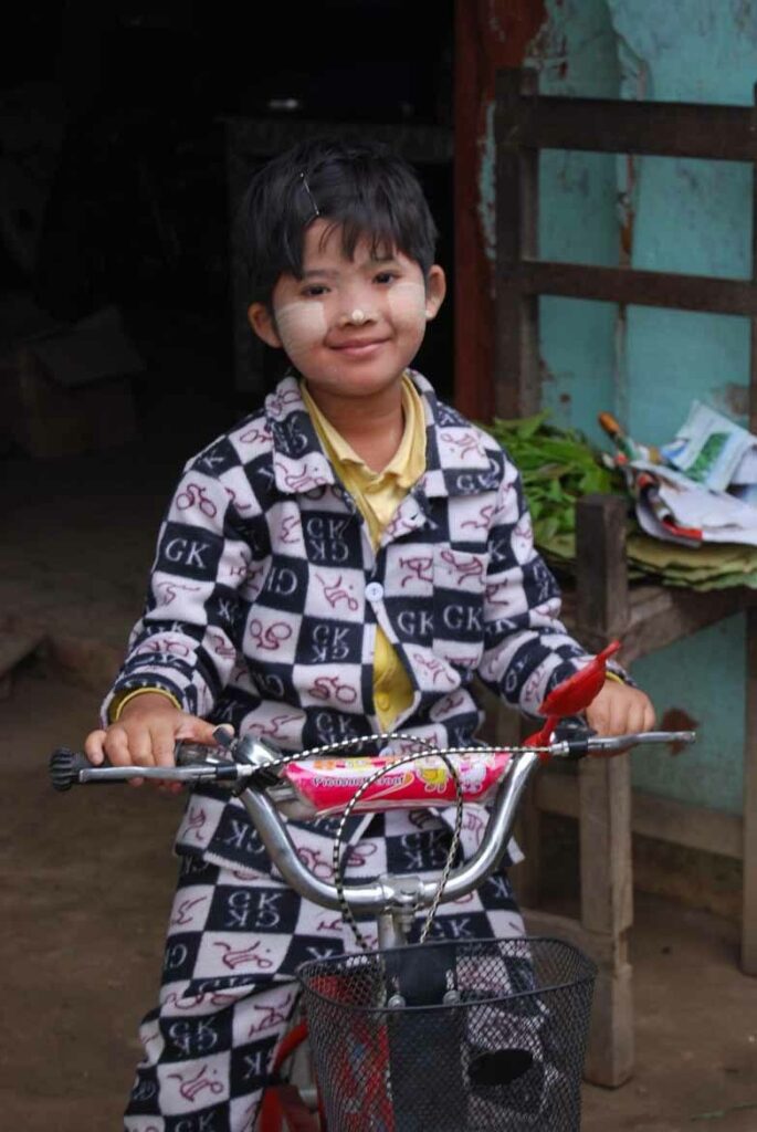 Burmese child on a tricycle