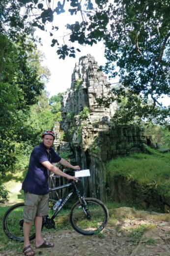 Tom cycling around the temples of Angkor