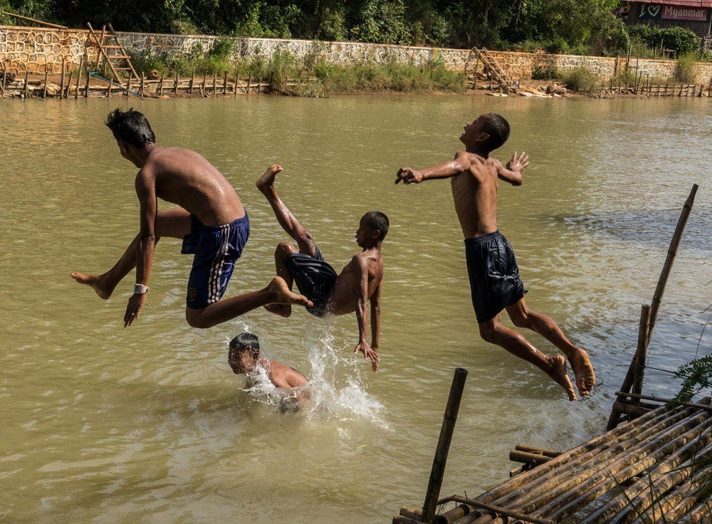 Travel Photography Competition - Children having jumping into lake in Burma 