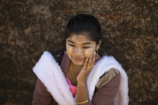 Photos of Burma - a women wearing Thanaka paste